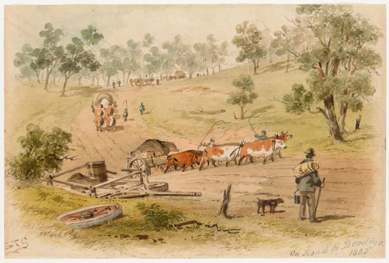 A digger stands with his dog and swag at his feet, behind a wrecked dray at the side of the road. A heavily laden dray is being hauled up the steep slope by a team of six bullocks, whose two drivers are whipping the team.